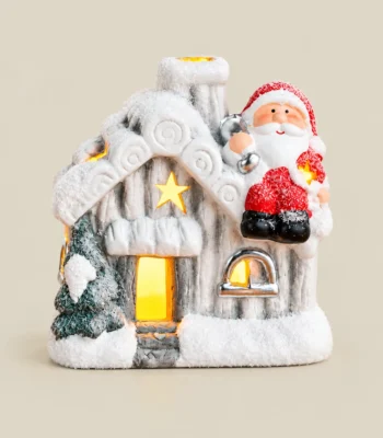 Battery-Operated LED Snowy Christmas Cottage with Santa Figurine