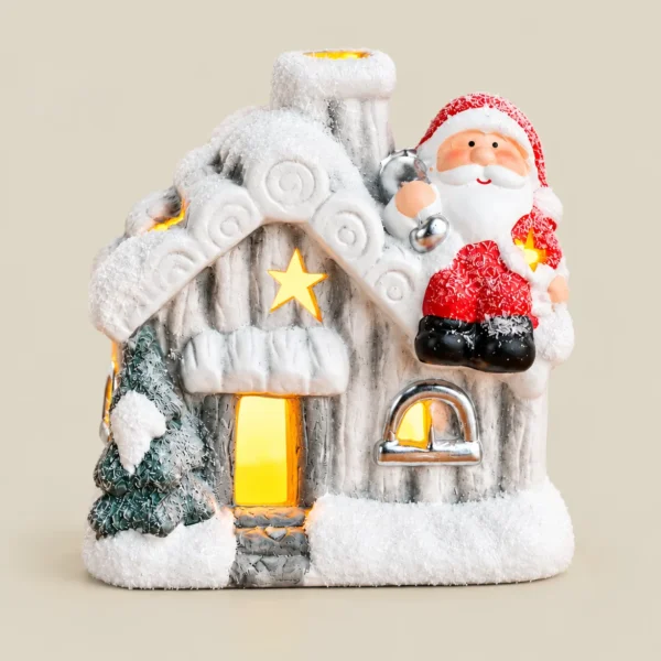 Battery-Operated LED Snowy Christmas Cottage with Santa Figurine
