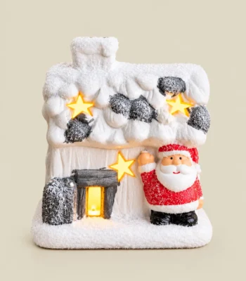 Snow-Covered Santa Christmas Cottage with Star Cutouts – Miniature Tabletop Décor